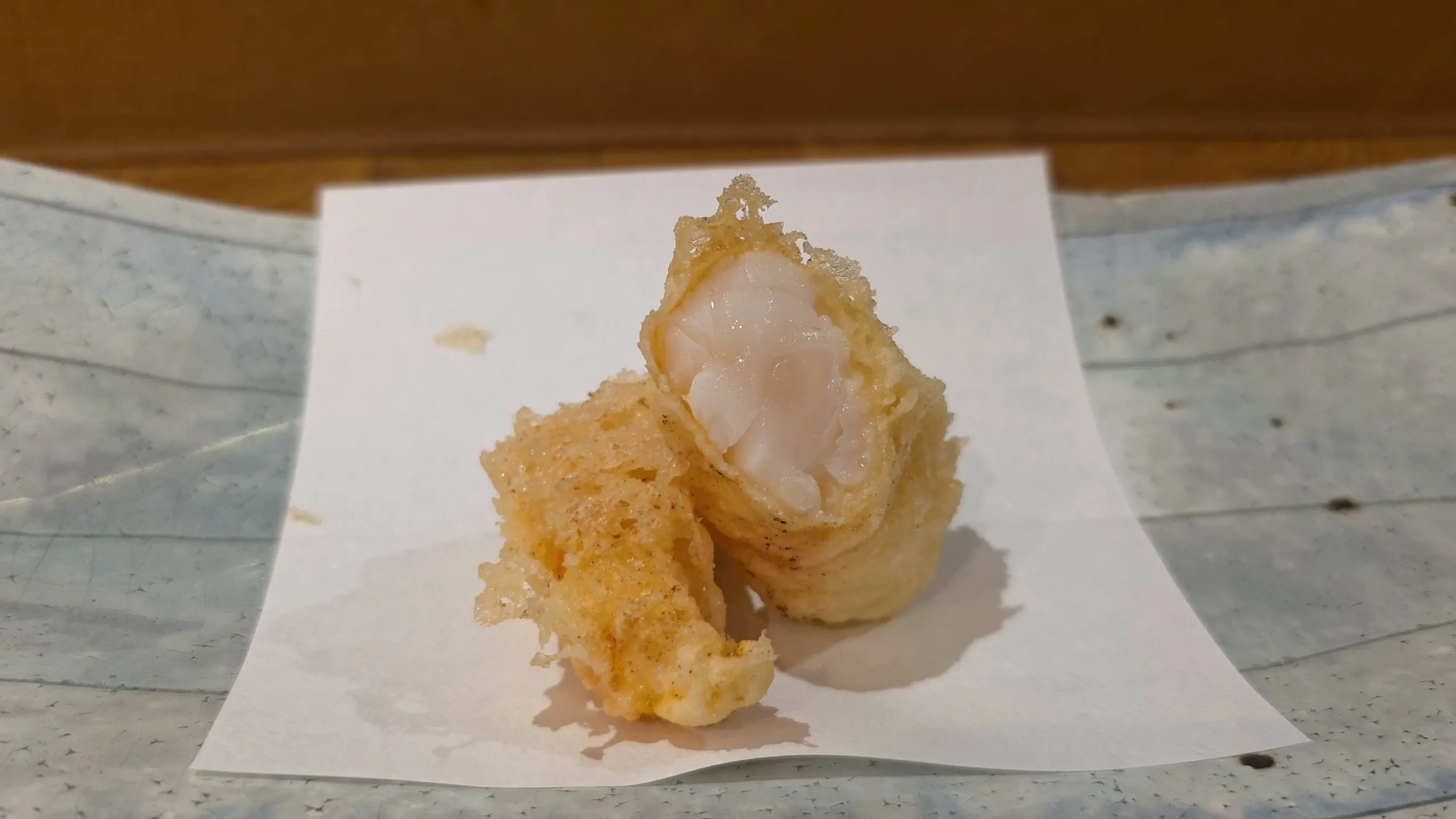 Botan ebi tempura cut in half to show the translucent center